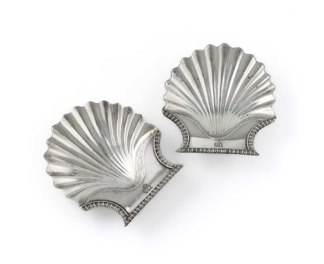 A matched pair of George III silver butter shells, by Rebecca Emes & Edward Barnard, London 1808, with a gadrooned border, en