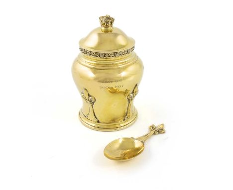 A silver-gilt tea caddy and spoon,  by Goldsmiths & Silversmiths Co Ltd, London 1936, baluster form, decorated with fleur-de-