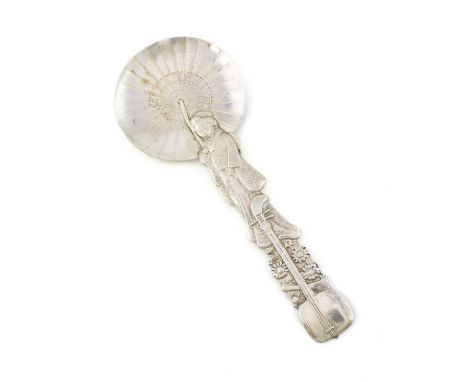 A Japanese silver caddy spoon, marked sterling, modelled as a female figure with a samisen, under a parasol, length 14.4cm, a