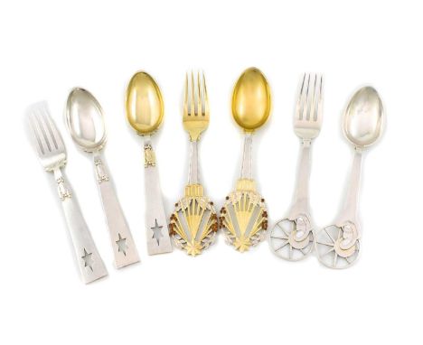 By A Michelson, a collection of Danish silver Christmas forks and spoons, comprising a silver-gilt Christmas 1922 spoon and f