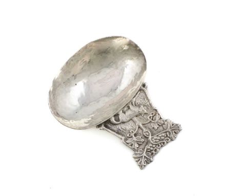 By A. E. Jones, an Arts and Crafts silver caddy spoon, Birmingham 1915, oval spot-hammered bowl, Tree of Life terminal, lengt