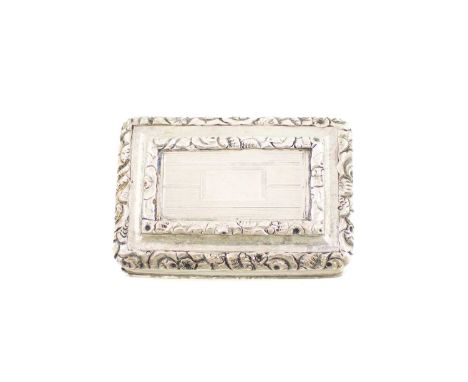 A George IV silver vinaigrette, by Thomas Shaw, Birmingham 1822,rectangular form with reeded sides, scroll foliate borders an