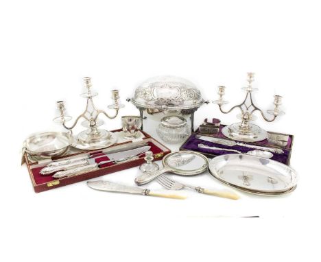 A mixed lot,comprising: a silver christening cup, a two-handled bowl, four napkin rings, a silver-mounted hand mirror, a jar 