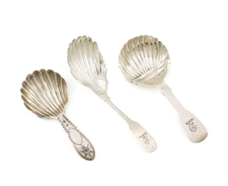 A small collection of three antique Irish silver caddy spoons, comprising: a Bright-cut Star one, with a shell bowl, by Thoma