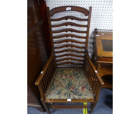 An Edwardian mahogany ladder back Armchair, with satinwood crossbanding, the curved cresting rail above multiple shaped mid r