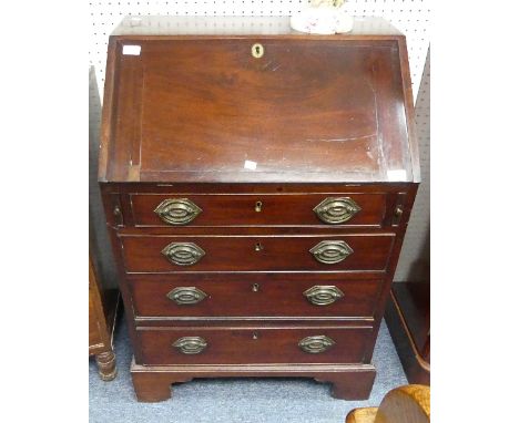 An early 19thC mahogany Bureau by Spillman &amp; Co, London, the interior fitted with pigeon holes and drawers, makers label 