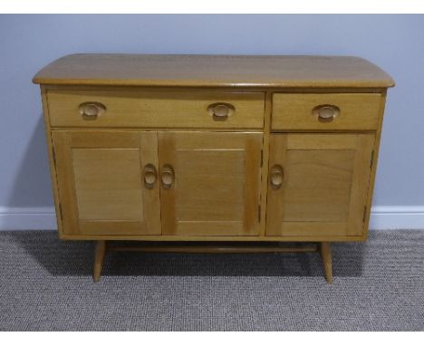 A mid 20thC Ercol light elm and beech Sideboard, Model 351, with a long drawer above a double cupboard beside a single cupboa