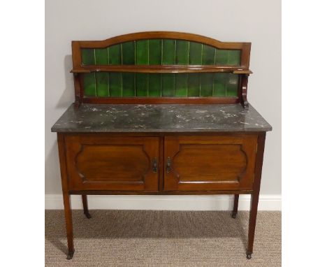 An Edwardian mahogany marble topped Washstand, with green tile back, on castors, 41½in (106cm) wide, 18½in (47cm) deep, 46in 