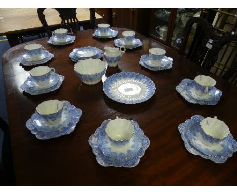 A Paragon twelve-place setting part Tea Service, comprising ten cups, twelve saucers, twelve Side Plates, Sugar Bowl, and Cak