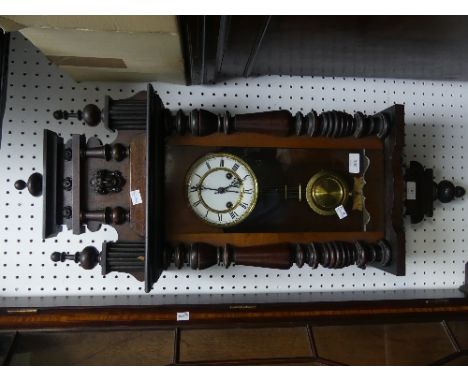 An early 20th century walnut Vienna Regulator style wall clock, of traditional form, the 8-day movement striking on a coiled 