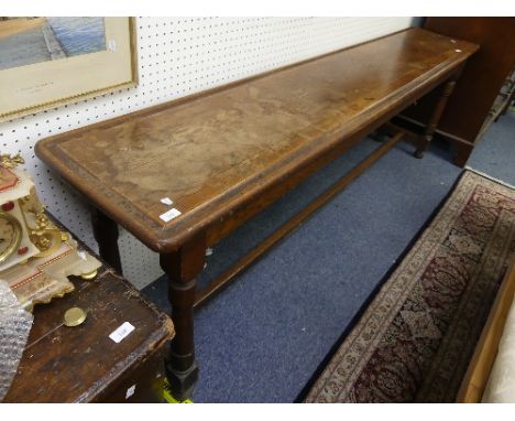 A vintage oak long Side / Console Table, the rectangular top with grooved rim on turned supports united by and H stretcher, w