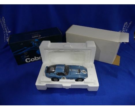 An Exoto 'Racing Legends' series 1:18 scale model of the 1964 Shelby Cobra Daytona Coupe, in blue with racing No.5, in origin