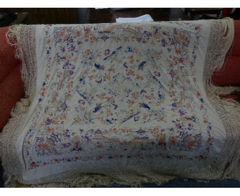 An early 20thC Chinese large silk embroidered Piano Shawl, the cream ground highly adorned in coloured silk threads with figu