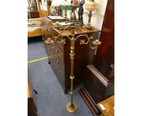 An early 20th century brass floor-standing five-light ecclesiastical Candelabrum, 54in (137cm) high.