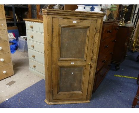 A vintage pine corner Cupboard, with two panel door, five shelf interior, 29in (74cm) wide, 50½in (128cm) high.