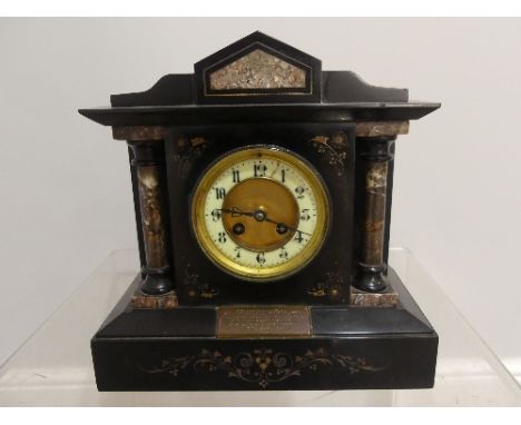 A Victorian slate and marble Mantle Clock, with presentation inscription dated 1891, 12in (30cm) wide, 12¼in (31cm) high.