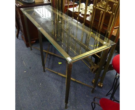 A mid 20thC glass and brass Console Table, the glass top raised upon twist-effect supports, with a double X-shaped stretcher 