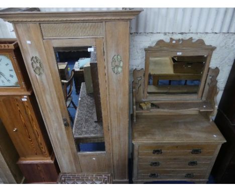 A late Victorian pine Dressing Table, with rectangular swing mirror on pierced shaped supports with she;f below, the chest wi