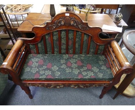 A Chinese export caned rosewood sofa, with shaped arched back, carved crest and scroll arms, 46in (117cm) wide x 39in (99cm) 