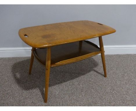 A mid 20thC Ercol beach and elm Tray Table, Model 457, the rounded rectangular tray top with two cut out handles, tapering su