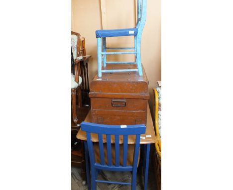 A Beech kitchen table, a tin trunk and three chairs