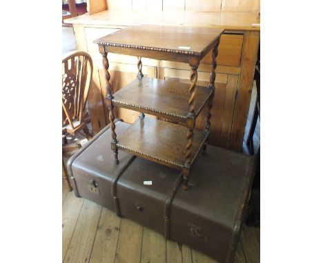 An Oak barley twist three tier occasional table and a trunk