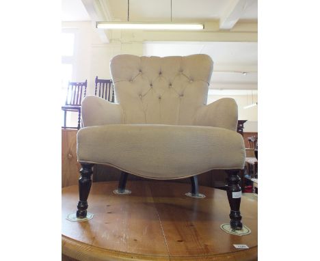 A cream upholstered button back armchair and two cane seat chairs