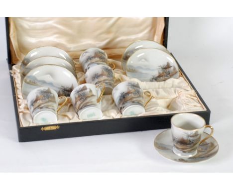 CASED SET OF SIX EARLY TWENTIETH CENTURY JAPANESE PEACOCK CHINA WARE TEA CUPS AND SAUCERS, hand painted with dwellings in mou