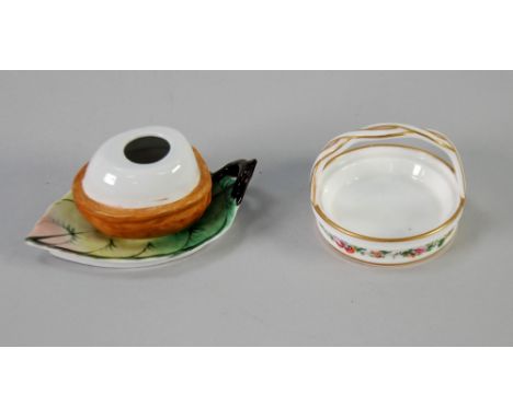 CONTINENTAL PORCELAIN BIRD'S EGG ON NEST INKWELL on leaf shaped base with rustic loop handle, polychrome painted, 4" long and