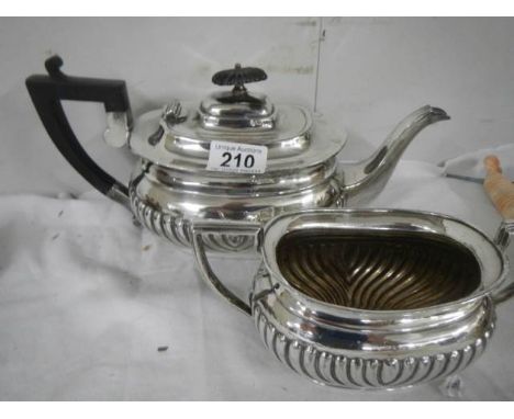 An early 20th century silver plate teapot and sugar bowl.