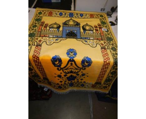 A yellow ground silk prayer mat.