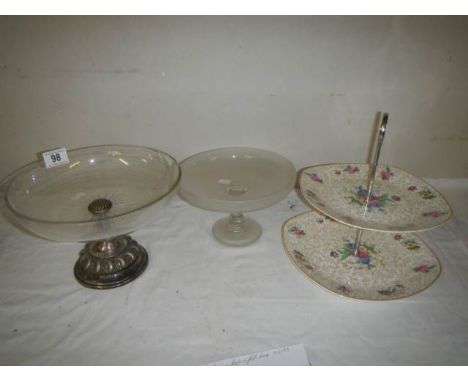 A Midwinter two tier cake stand and two glass comports including one with plated base.