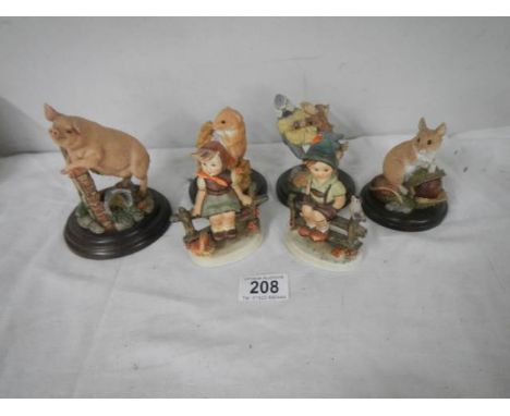 Two Goebel figures and four animal figures.