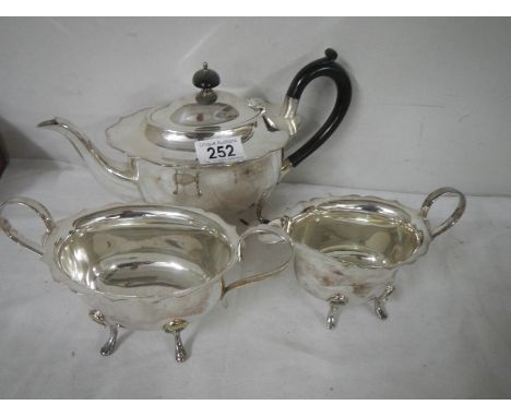 A three piece silver plate tea set.
