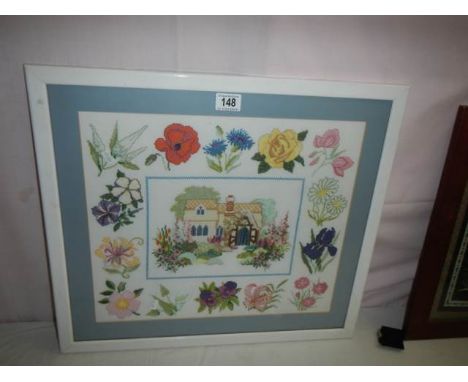 A framed and glazed embroidery.