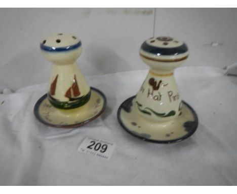 Two Torquay motto ware hat pin stands.