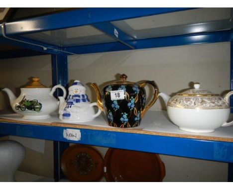 Four collector's teapots including Wedgwood.White Wedgwood teapot has no cracks or chips, gilding in good condition, some sta