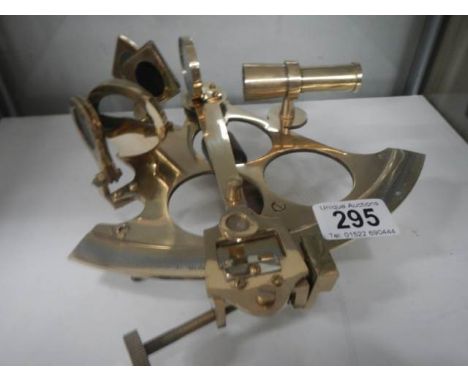 A polished brass sextant.