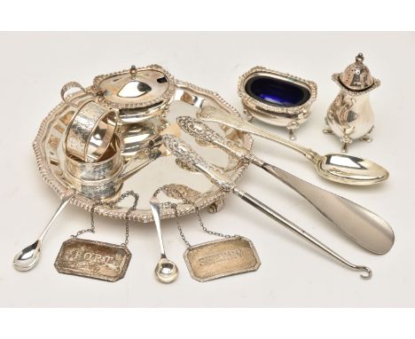 A SMALL ASSORTMENT OF SILVER ITEMS, to include a small circular waiter with gadrooned rim, raised on three scrolling feet, ha