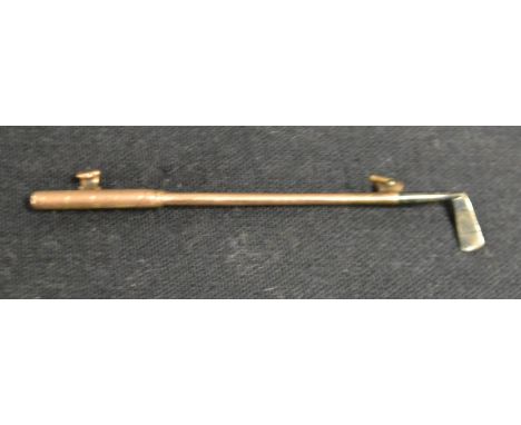 A 9ct gold and silver golf club tie pin, stamped 9ct sil, 2.6g gross  