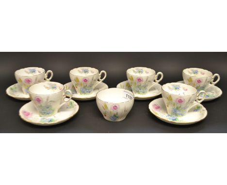 A Shelley Demitasse tea set for six,pattern no.823343,decorated with flowers comprising six cups and saucers, sugar bowl, pri