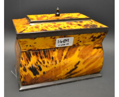A faux tortoise shell caddy and cover