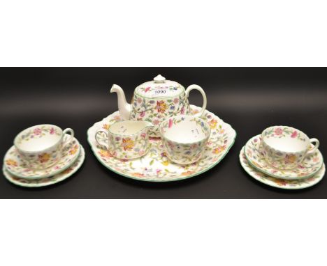 A Minton Haddon Hall tête-à-tête tea set comprising bachelor teapot, creamer, sugar bowl, side plates, cake plate, cups and s