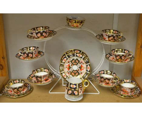 Royal Crown Derby - a 2451 Imari eight setting tea service including cups, saucers, side plates, milk jug, sugar bowl, etc., 