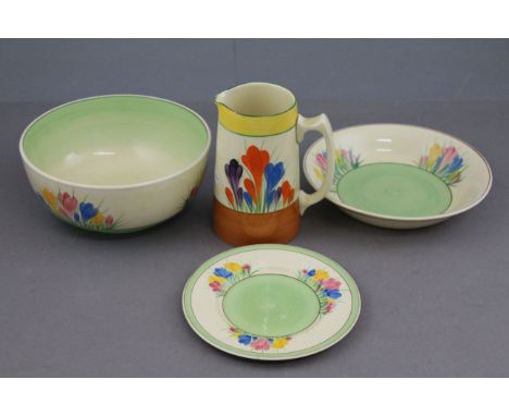 Clarice Cliff Crocus pattern bowl together with a similar jug, dish and plate marked for Newport Pottery 