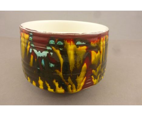 Poole Pottery planter with ribbed design, number 92, in dark red ground colour 