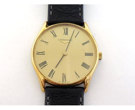 LONGINES, a gentleman's gilt metal manual wind dress watch, the gilt metal dial with black Roman numerals and fine baton hand