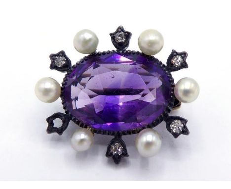 A Victorian amethyst, diamond and seed pearl brooch, the central oval cut amethyst 12 x 8mm, in a surround of small mine cut 