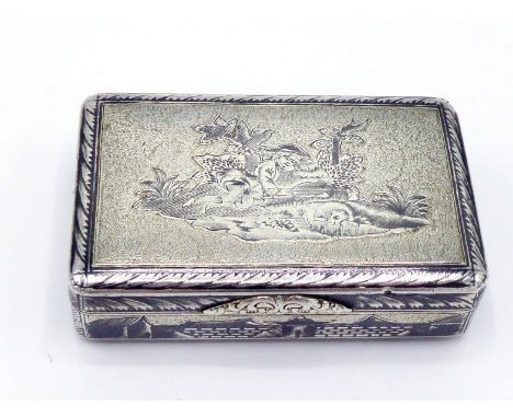 A Russian parcel-gilt silver and niello snuff box, maker's mark D.A.P. (Cyrillic), Moscow, 1844, cover depicting a young man 