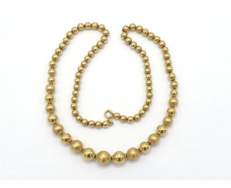 An Italian 18 carat gold bead necklace, composed of alternate matt and polished graduated beads, the bolt ring clasp with Ita